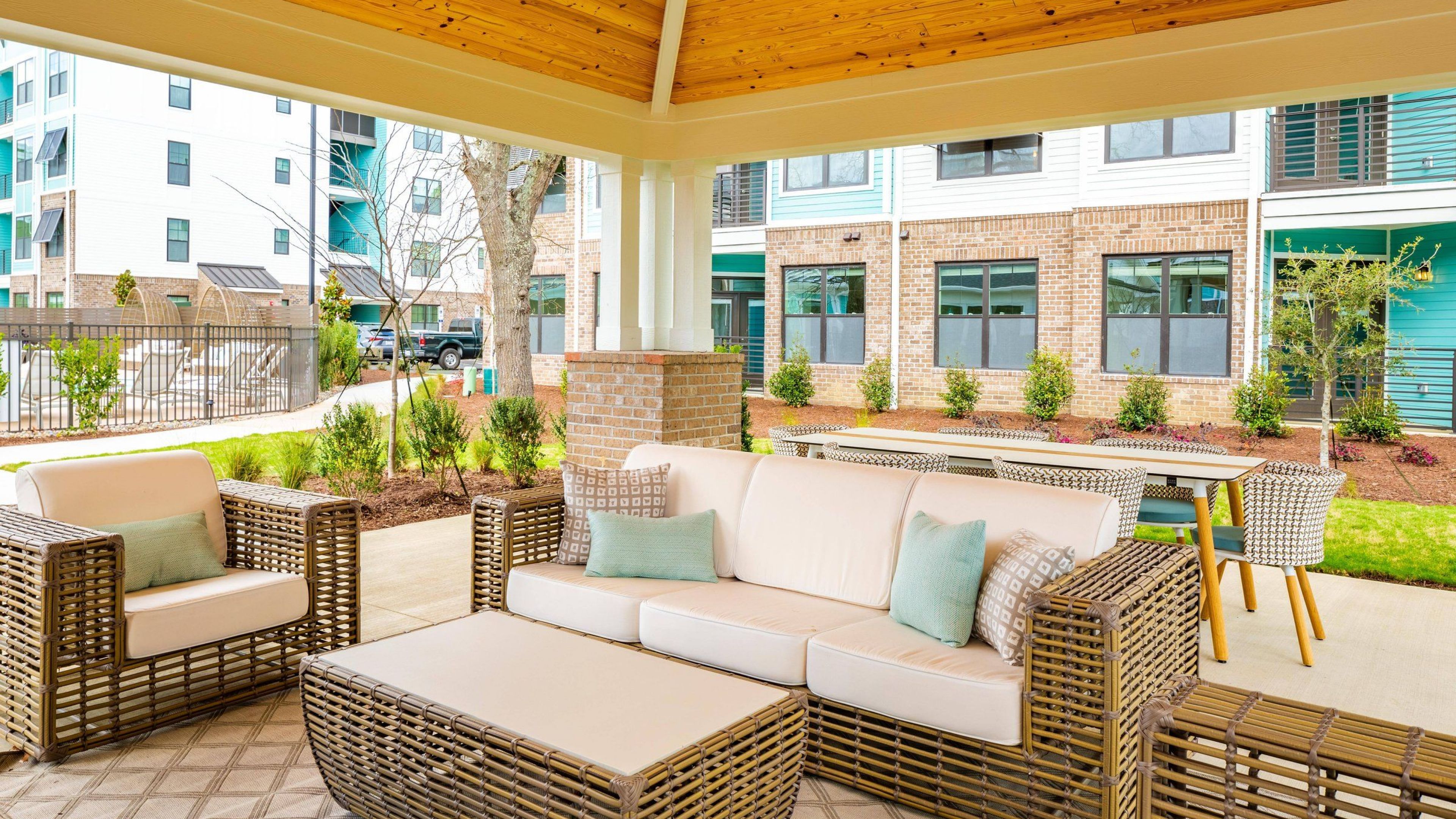 Hawthorne at Oleander outdoor pavilion with lounge seating overlooking an outdoor pool