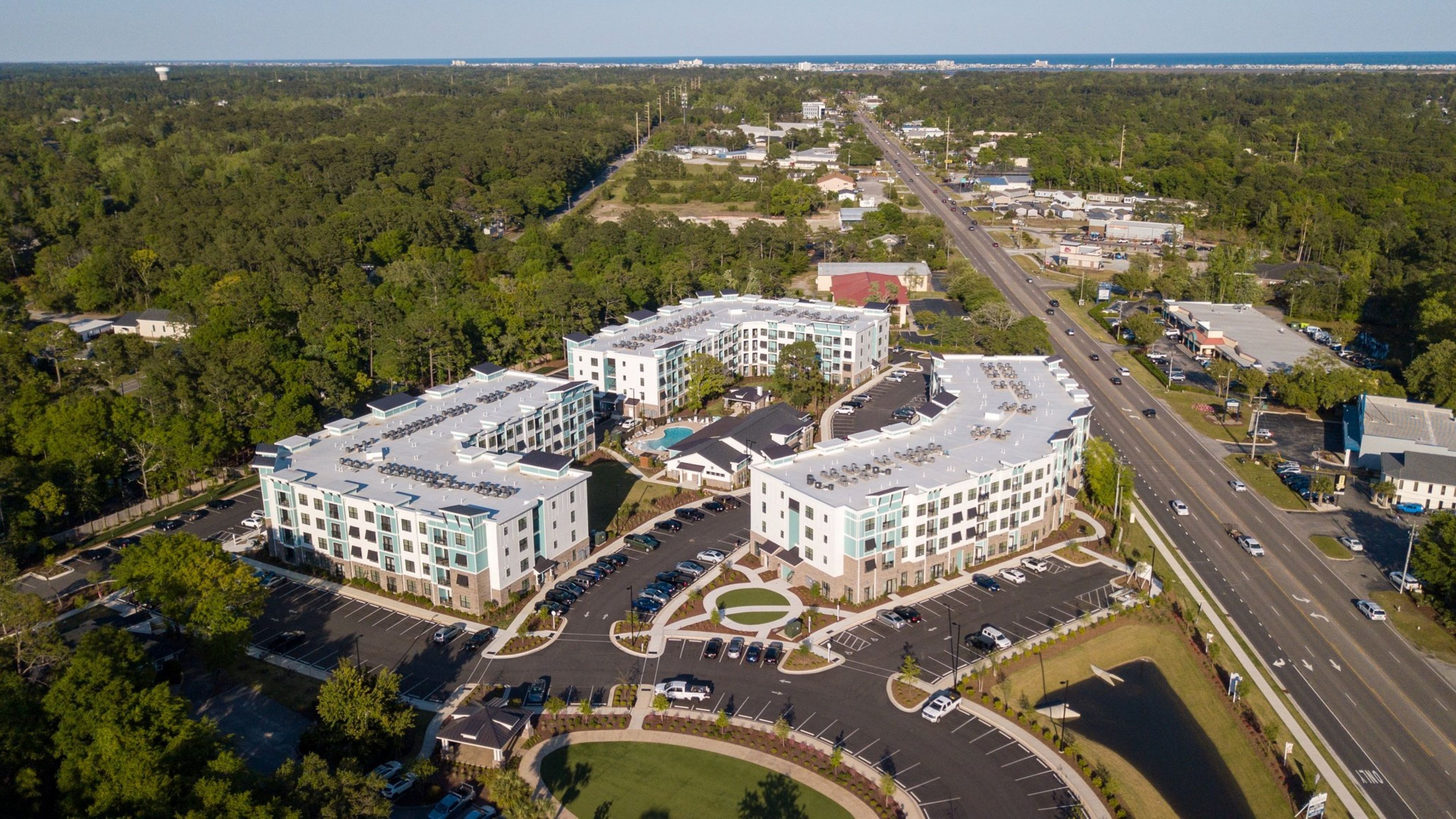 Hawthorne at Oleander aerial view showing the apartment building and surrounding area of Wilmington, NC